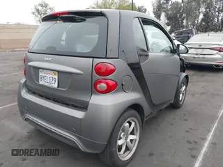 2015 Smart fortwo Passion with VIN WMEEJ3BA1FK787744, listed as a IAAI auction lot 42095001 with 43,370 mi miles and . Bid and sale history available at DreamBid. Image 4.