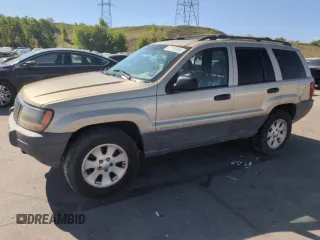 2001 Jeep Grand Cherokee Laredo z VIN 1J4GW48N11C671109, wystawiony jako Copart lot #57710355 z przebiegiem 176 559 mil mil oraz Czysty tytuł • Clean title. Historia ofert i sprzedaży dostępna na DreamBid. Obrazek 1.