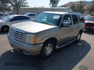 2002 Cadillac Escalade z VIN 1GYEC63T82R138951, wystawiony jako IAAI lot #42164804 z przebiegiem 265 812 mil mil oraz . Historia ofert i sprzedaży dostępna na DreamBid. Obrazek 2.