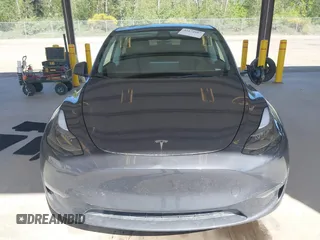 2023 Tesla Model Y Long Range with VIN 7SAYGAEE4PF906577, listed as a IAAI auction lot 42174987 with 13,260 mi miles and . Bid and sale history available at DreamBid. Image 12.