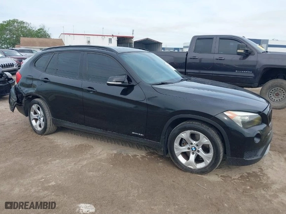 2014 BMW X1 sDrive28i with VIN WBAVM1C54EVW46561, listed as a IAAI auction lot 41880387 with 125,096 mi miles. Bid and sale history available at carsss.com. Image 1.