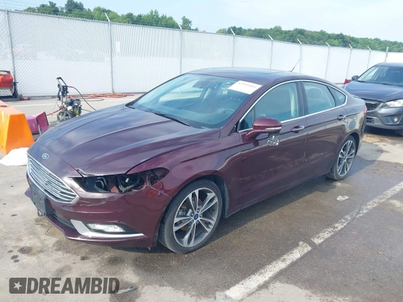 2017 Ford Fusion Titanium z VIN 3FA6P0K94HR271307, wystawiony jako IAAI lot #42595411 z przebiegiem 100 344 mil mil oraz . Historia ofert i sprzedaży dostępna na DreamBid. Obrazek 2.