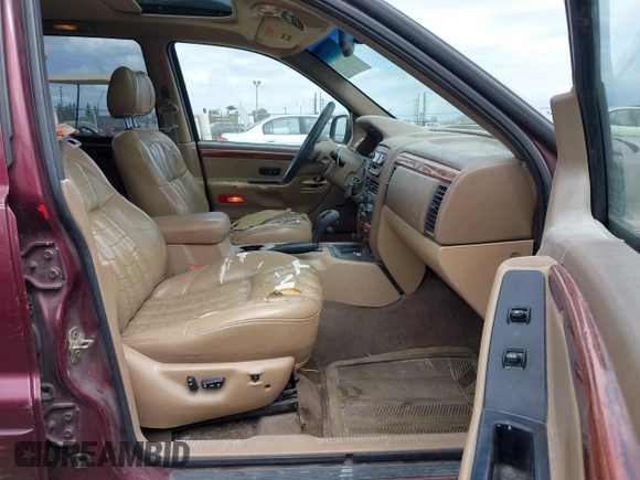 1999 Jeep Grand Cherokee Limited with VIN 1J4GW68N3XC696825, listed as a IAAI auction lot 42117857 with 236,300 mi miles. Bid and sale history available at carsss.com. Image 5.
