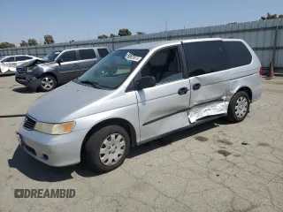 2001 Honda Odyssey LX with VIN 2HKRL18521H609633, listed as a Copart auction lot 59930615 with 237,134 mi miles and Salvage title. Bid and sale history available at DreamBid. Image 1.