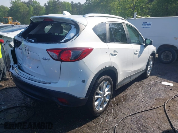 2014 Mazda CX-5 Grand Touring with VIN JM3KE2DY1E0424890, listed as a IAAI auction lot 42052437 with 107,793 mi miles. Bid and sale history available at carsss.com. Image 4.