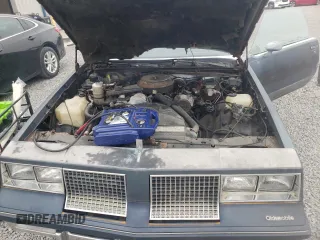 1983 Oldsmobile Cutlass Supreme z VIN 1G3AR47A1DM520447, wystawiony jako Copart lot #58216235 z przebiegiem 88 361 mil mil oraz Szkoda całkowita • Salvage title. Historia ofert i sprzedaży dostępna na DreamBid. Obrazek 11.