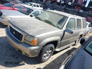 2000 Cadillac Escalade z VIN 1GYEK63R2YR209125, wystawiony jako IAAI lot #41854270 z przebiegiem 198 017 mil mil oraz . Historia ofert i sprzedaży dostępna na DreamBid. Obrazek 2.