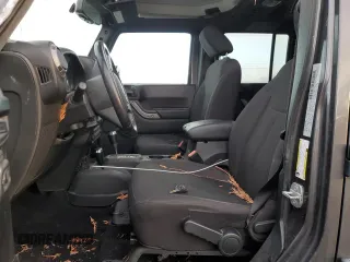 2018 Jeep Wrangler JK Unlimited Sport S with VIN 1C4BJWDG7JL814744, listed as a Copart auction lot 77830714 with 130,229 mi miles and Salvage Title. Bid and sale history available at carsss.com. Image 7.