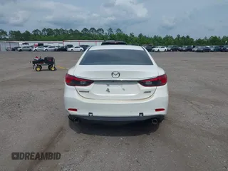 2014 Mazda 6 i Touring with VIN JM1GJ1V64E1142643, listed as a IAAI auction lot 42229322 with 215,095 mi miles and . Bid and sale history available at DreamBid. Image 16.