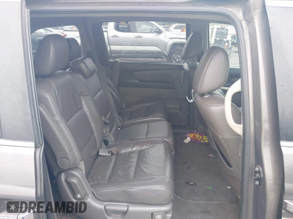 2012 Honda Odyssey EX-L with VIN 5FNRL5H64CB060468, listed as a IAAI auction lot 42182501 with 236,399 mi miles and . Bid and sale history available at carsss.com. Image 8.