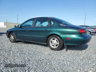 1999 Ford Taurus SE with VIN 1FAFP53U2XG184723, listed as a Copart auction lot 60787115 with 128,277 mi miles and Salvage title. Bid and sale history available at DreamBid. Image 2.