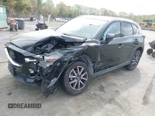 2018 Mazda CX-5 Grand Touring with VIN JM3KFBDM1J0358197, listed as a IAAI auction lot 41967940 with 148,119 mi miles and . Bid and sale history available at DreamBid. Image 17.