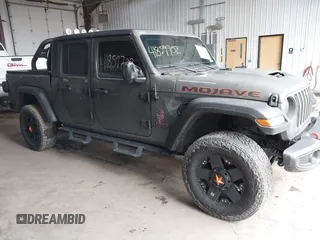 2021 Jeep Gladiator Mojave z VIN 1C6JJTEG7ML590489, wystawiony jako IAAI lot #41859702 z przebiegiem 35 065 mil mil oraz . Historia ofert i sprzedaży dostępna na DreamBid. Obrazek 1.
