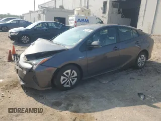 2016 Toyota Prius Four z VIN JTDKARFUXG3506027, wystawiony jako Copart lot #59711465 z przebiegiem 108 679 mil mil oraz Szkoda całkowita • Salvage title. Historia ofert i sprzedaży dostępna na DreamBid. Obrazek 1.