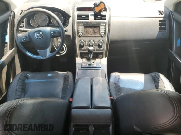 2014 Mazda CX-9 Touring with VIN JM3TB3CA6E0441708, listed as a Copart auction lot 61143785 with 173,562 mi miles and Salvage title. Bid and sale history available at DreamBid. Image 8.