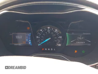 2014 Ford Fusion Titanium Hybrid with VIN 3FA6P0RUXER103516, listed as a IAAI auction lot 42004602 with 128,287 mi miles and . Bid and sale history available at carsss.com. Image 7.