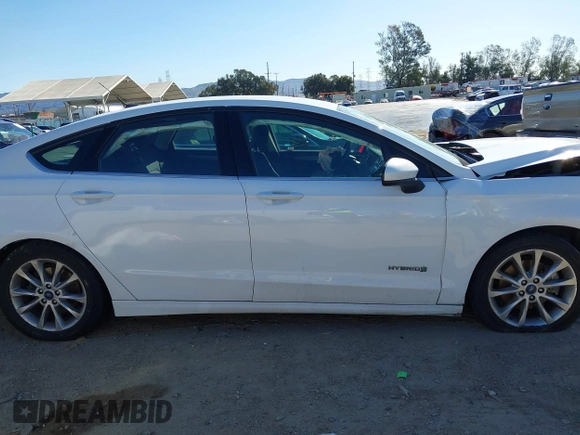 2018 Ford Fusion SE z VIN 3FA6P0LU3JR102971, wystawiony jako IAAI lot #41814321 z przebiegiem 135 472 mil mil oraz . Historia ofert i sprzedaży dostępna na DreamBid. Obrazek 13.
