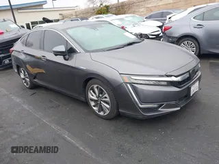 2018 Honda Clarity Plug-In Hybrid with VIN JHMZC5F13JC022276, listed as a IAAI auction lot 41731736 with 170,331 mi miles. Bid and sale history available at carsss.com. Image 1.