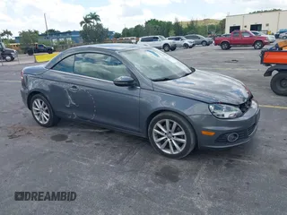 2014 Volkswagen Eos Sport z VIN WVWBW8AH2EV000313, wystawiony jako IAAI lot #42333112 z przebiegiem 106 125 mil mil oraz . Historia ofert i sprzedaży dostępna na DreamBid. Obrazek 1.