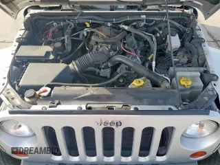 2009 Jeep Wrangler Sahara z VIN 1J4FA54169L780809, wystawiony jako Copart lot #50598925 z przebiegiem 121 078 mil mil oraz Szkoda całkowita • Salvage title. Historia ofert i sprzedaży dostępna na DreamBid. Obrazek 11.
