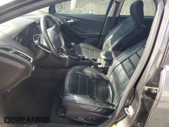 2015 Ford Focus Titanium z VIN 1FADP3N28FL239706, wystawiony jako Copart lot #62478895 z przebiegiem 143 536 mil mil oraz Szkoda całkowita • Salvage title. Historia ofert i sprzedaży dostępna na DreamBid. Obrazek 7.