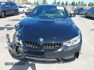 2015 BMW M4 with VIN WBS3R9C58FK334247, listed as a IAAI auction lot 41940211 with 125,881 mi miles. Bid and sale history available at carsss.com. Image 11.