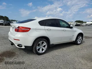 2014 BMW X6 xDrive35i z VIN 5UXFG2C53E0C42900, wystawiony jako Copart lot #55641745 z przebiegiem 156 045 mil mil oraz Tytuł czysty. Historia ofert i sprzedaży dostępna na DreamBid. Obrazek 3.
