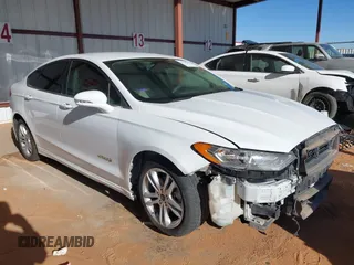 2018 Ford Fusion SE z VIN 3FA6P0LU1JR261195, wystawiony jako IAAI lot #41864332 z przebiegiem 98 834 mil mil oraz . Historia ofert i sprzedaży dostępna na DreamBid. Obrazek 1.