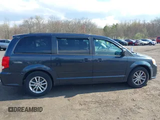 2013 Dodge Grand Caravan SXT with VIN 2C4RDGCG2DR652708, listed as a IAAI auction lot 42043026 with 245,442 mi miles and . Bid and sale history available at DreamBid. Image 6.