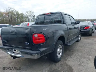 2001 Ford F-150 SuperCrew XLT with VIN 1FTRW08L61KF76055, listed as a IAAI auction lot 42027968 with 301,095 mi miles. Bid and sale history available at carsss.com. Image 4.