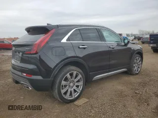 2022 Cadillac XT4 AWD Premium Luxury z VIN 1GYFZDR43NF132553, wystawiony jako Copart lot #50869955 z przebiegiem 25 412 mil mil oraz Szkody całkowita. Historia ofert i sprzedaży dostępna na DreamBid. Obrazek 3.