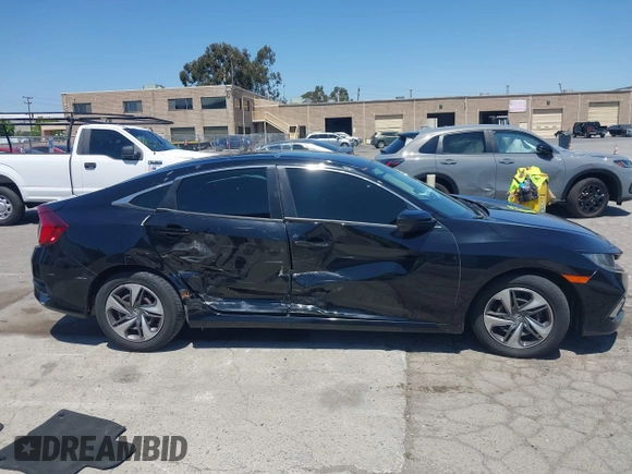 2020 Honda Civic LX with VIN 19XFC2F66LE213975, listed as a IAAI auction lot 42398098 with 69,902 mi miles and . Bid and sale history available at DreamBid. Image 13.