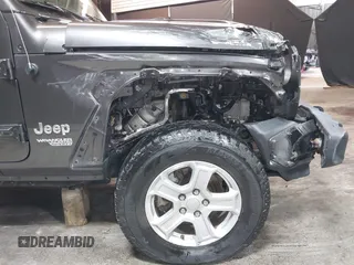 2018 Jeep Wrangler Unlimited Sport S with VIN 1C4HJXDG5JW126496, listed as a IAAI auction lot 42390584 with 163,476 mi miles and . Bid and sale history available at DreamBid. Image 12.