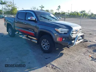 2018 Toyota Tacoma SR5 with VIN 3TMAZ5CN4JM069965, listed as a IAAI auction lot 41798238 with 124,619 mi miles and . Bid and sale history available at DreamBid. Image 1.