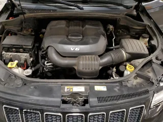 2015 Jeep Grand Cherokee Overland with VIN 1C4RJFCG7FC911899, listed as a Copart auction lot 54123925 with 243,031 mi miles and Salvage Title. Bid and sale history available at carsss.com. Image 12.