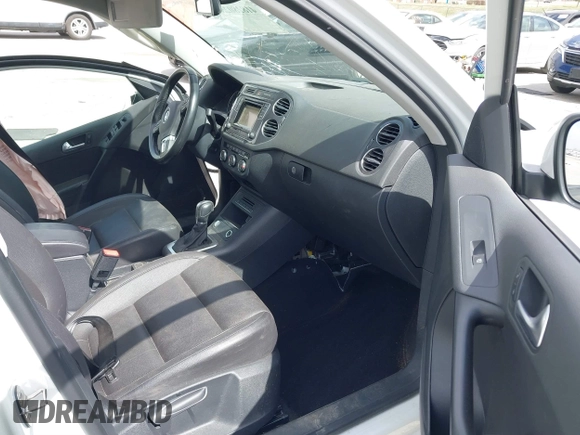 2016 Volkswagen Tiguan S with VIN WVGBV7AX5GW600479, listed as a IAAI auction lot 41828028 with 131,910 mi miles and . Bid and sale history available at DreamBid. Image 5.