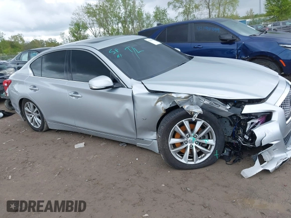 2015 Infiniti Q50 Premium z VIN JN1BV7AR8FM390785, wystawiony jako IAAI lot #42200437 z przebiegiem 94 841 mil mil oraz . Historia ofert i sprzedaży dostępna na DreamBid. Obrazek 13.