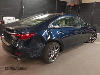 2017 Mazda 6 Grand Touring with VIN JM1GL1W51H1101519, listed as a IAAI auction lot 42132215 with 145,796 mi miles. Bid and sale history available at carsss.com. Image 4.