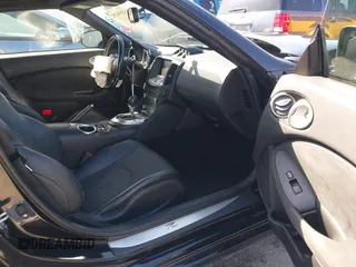 2014 Nissan 370Z Touring with VIN JN1AZ4FH8EM620208, listed as a IAAI auction lot 42094292 with 68,799 mi miles and . Bid and sale history available at DreamBid. Image 5.
