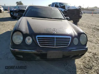2001 Mercedes-Benz E-Class AWD with VIN WDBJF82JX1X044733, listed as a Copart auction lot 74825034 with 153,046 mi miles and Salvage Title. Bid and sale history available at carsss.com. Image 5.
