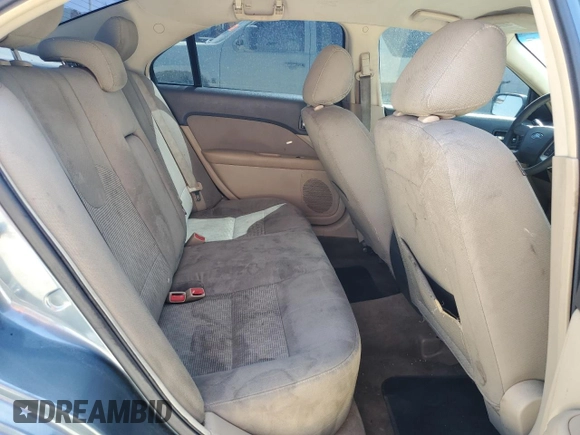 2012 Ford Fusion SE z VIN 3FAHP0HA0CR213729, wystawiony jako Copart lot #52458665 z przebiegiem 107 419 mil mil oraz Czysty tytuł • Clean title. Historia ofert i sprzedaży dostępna na DreamBid. Obrazek 10.