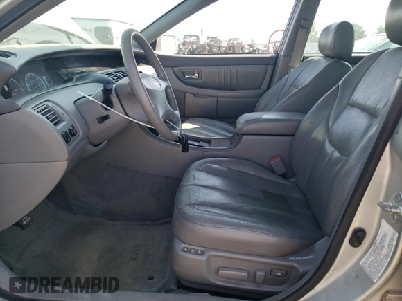 2000 Toyota Avalon XL with VIN 4T1BF28B7YU112576, listed as a Copart auction lot 59726505 with 242,412 mi miles and Salvage title. Bid and sale history available at DreamBid. Image 7.