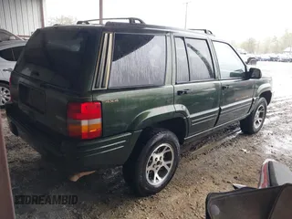 1997 Jeep Grand Cherokee Limited with VIN 1J4GZ78Y5VC723429, listed as a IAAI auction lot 42012836 with 231,126 mi miles. Bid and sale history available at carsss.com. Image 4.