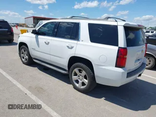 2015 Chevrolet Tahoe LT with VIN 1GNSKBKC8FR194164, listed as a IAAI auction lot 42315215 with 211,797 mi miles and . Bid and sale history available at DreamBid. Image 3.