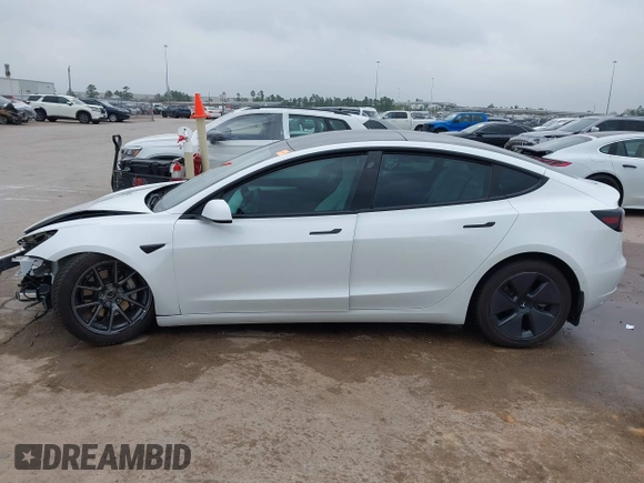 2021 Tesla Model 3 Long Range with VIN 5YJ3E1EB3MF059713, listed as a IAAI auction lot 41778289 with 52,211 mi miles. Bid and sale history available at carsss.com. Image 15.