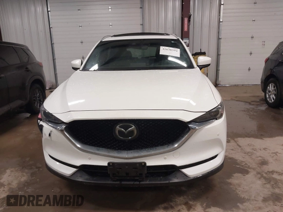 2019 Mazda CX-5 Signature with VIN JM3KFBEY5K0520593, listed as a IAAI auction lot 41638594 with 111,504 mi miles. Bid and sale history available at carsss.com. Image 12.
