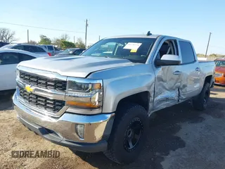2018 Chevrolet Silverado 1500 LT with VIN 3GCPCREC9JG574686, listed as a IAAI auction lot 41676124 with 74,239 mi miles and . Bid and sale history available at DreamBid. Image 6.