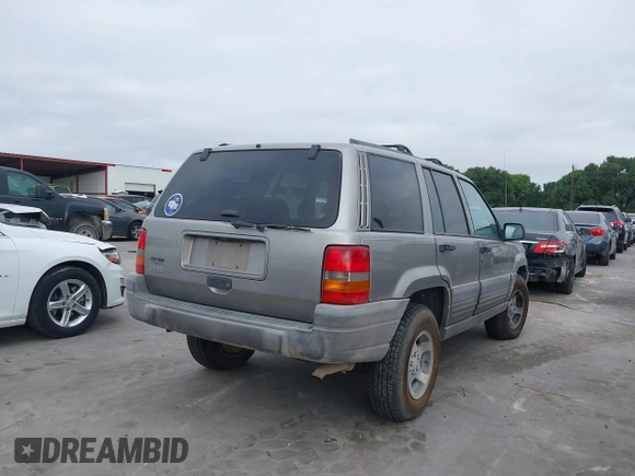 1998 Jeep Grand Cherokee Laredo with VIN 1J4FX58S6WC354101, listed as a IAAI auction lot 42158671 with 289,318 mi miles and . Bid and sale history available at DreamBid. Image 4.