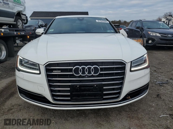 2015 Audi A8 z VIN WAUJGAFD9FN003570, wystawiony jako Copart lot #87642905 z przebiegiem 71 523 mil mil oraz Czysty tytuł • Clean title. Historia ofert i sprzedaży dostępna na DreamBid. Obrazek 5.