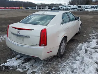 2009 Cadillac CTS AWD w/1SA with VIN 1G6DG577990169317, listed as a IAAI auction lot 41450158 with 144,768 mi miles. Bid and sale history available at carsss.com. Image 4.